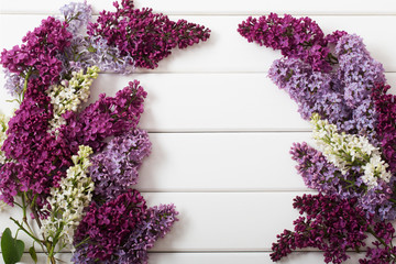 The beautiful lilac on a wooden background