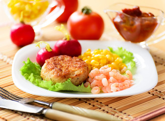 Chicken cutlets with canned corn and shrimp.