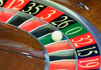 American Roulette wheel with a ball in the number