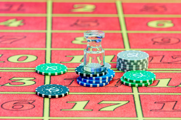 Casino. American Roulette gambling table with a playing chips and dolly on the layout.
