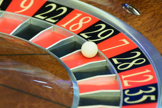 American Roulette wheel with a ball in the number