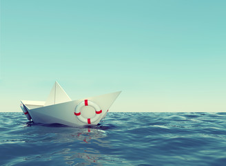 Paper boat in sea