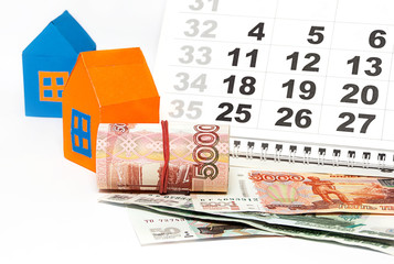 Money, house and calendar