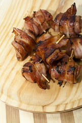 Deep fried sausages rolled in bacon