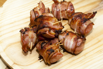 Deep fried sausages rolled in bacon