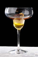 Fine dining dessert, Hazelnut ice cream with real gold leaves and black chocolate on olive oil