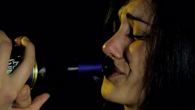 lonely woman depressed getting drunk with bottle of wine closeup