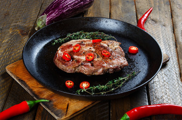 Cooking a steak in a frying pan