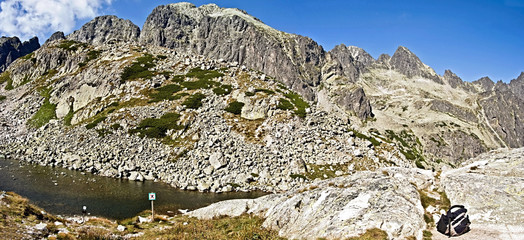 High Tatras mountains with lake, peaks and blue sky near Zbojnicka chata chalet in Velka Studena dolina mountain valley © honza28683