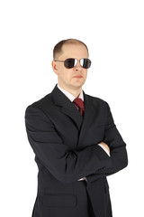 Security guard wearing a suit and sunglasses isolated on white background