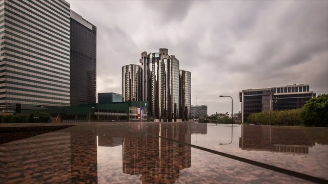 Building Loop Timelapse / A HD looped time-lapse of downtown buildings during a cloudy sky.
