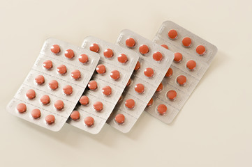 plates with orange tablets