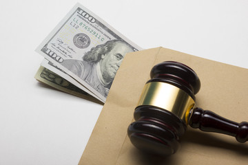 judge gavel and american dollars on white background