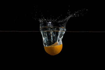 cut orange fell into the water