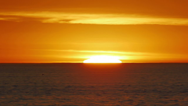 Sea Sunset Speedup. 400mm lens view of the Sun Setting in the California Pacific Coastline