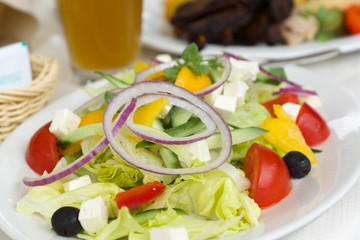 Fototapeta na wymiar the big portion of the Greek salad