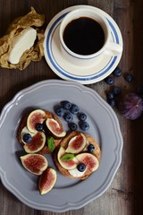 Fototapeta na wymiar Toast with figs and blueberry