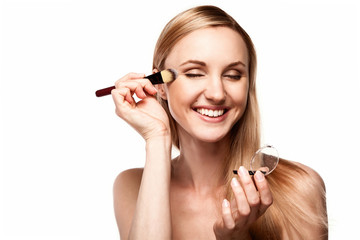 Fototapeta premium Beautiful woman applying eye makeup