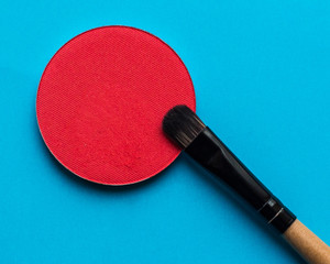 For Make-up. Bright shade with  brush on a blue background 