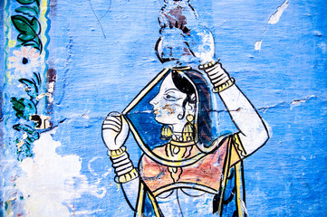 Traditional Indian painting on the wall, "Girl with a jug"