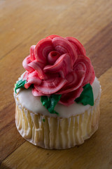 cupcake topped with a rose