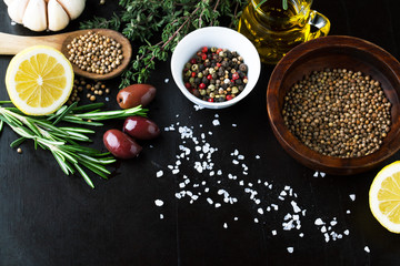 Fragrant Herbs and spices with a lemon and olives