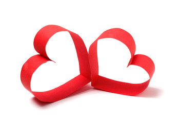 Two red paper hearts isolated on white background