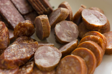 sliced sausage on a plate more types