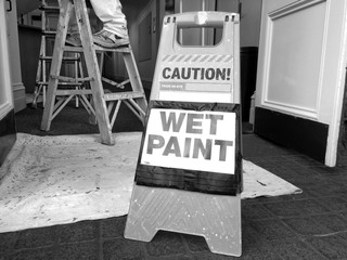 Hazard sign reads: Caution Wet Paint