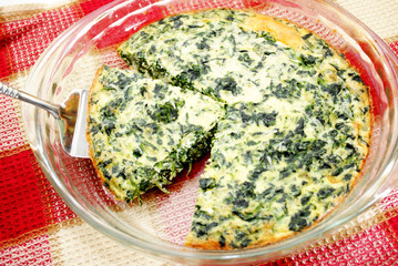 Serving Egg Quiche with Spinach and Cheese