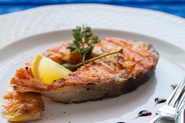 Grilled humpback salmon with a lemon slice