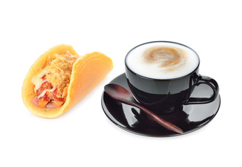capuccino coffee and rolled pancakes stuffed ham cheese on white
