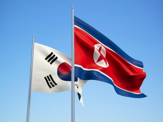 South Korea and North Korea flags waving in the wind with a blue sky background. 3d illustration