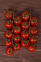 tomatoes bunch on wooden table
