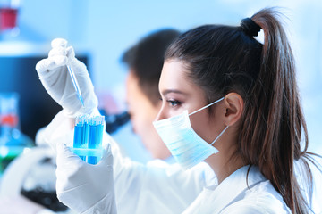 Young medical technicians working in laboratory