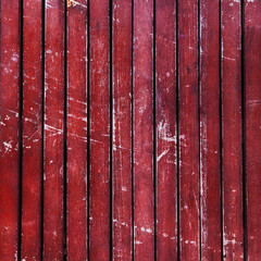 Red wooden timber / scuffed planks background texture.