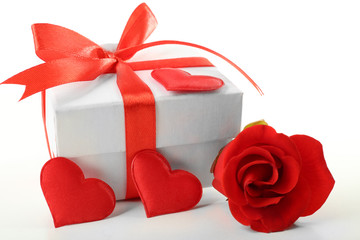 Gift box, rose flower and decorative heart, isolated on white
