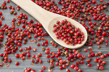 red peppercorns on table background