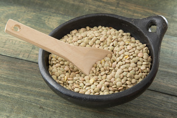 delicious lentil on wooden background.