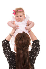 Back of mom raise her baby girl