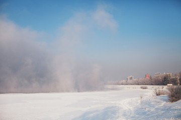 fog, steam on a frozen river
