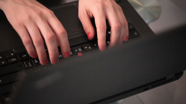 Closeup business woman working on laptop