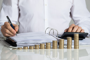 Businessman Calculating Invoice
