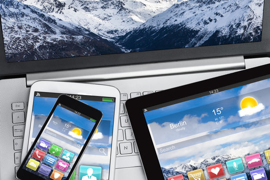 Digital Tablet And Smartphones On Laptop