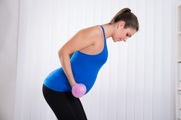 Pregnant Female Doing Exercise