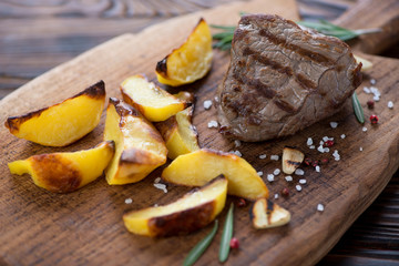 Close-up of grilled filet mignon beefsteak served with potato