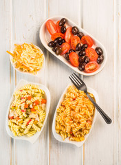 tomato and olive salad and fusilli pasta