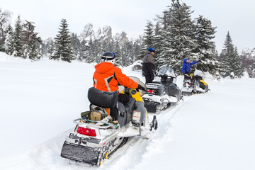 Athletes on a snowmobile