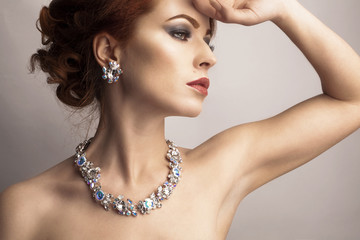 Beautiful woman with evening make-up. Jewelry and Beauty. Fashion photo