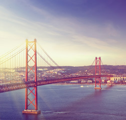 Fototapeta premium Red bridge, Lisbon, Portugal. Vintage colored travel background